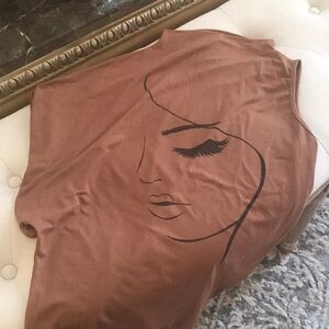 Brown Sleeveless Top with Artistic Face Design